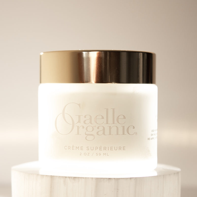 Creme Superieure, a rich organic moisturizer for mature dry skin, backlit.