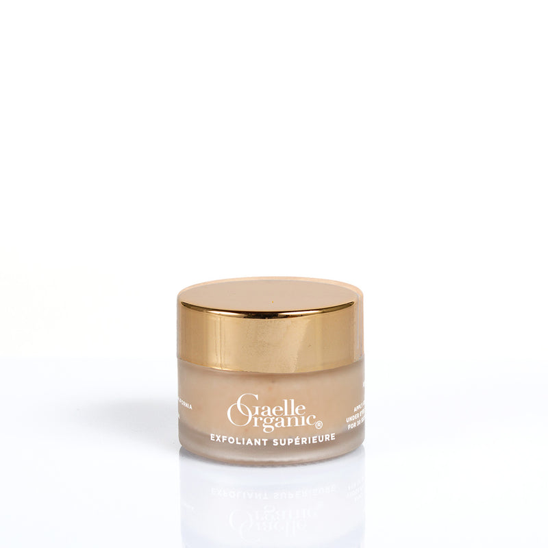 Exfolisnt Superieure travel-size, the best organic exfoliator for mature skin, on a plain background