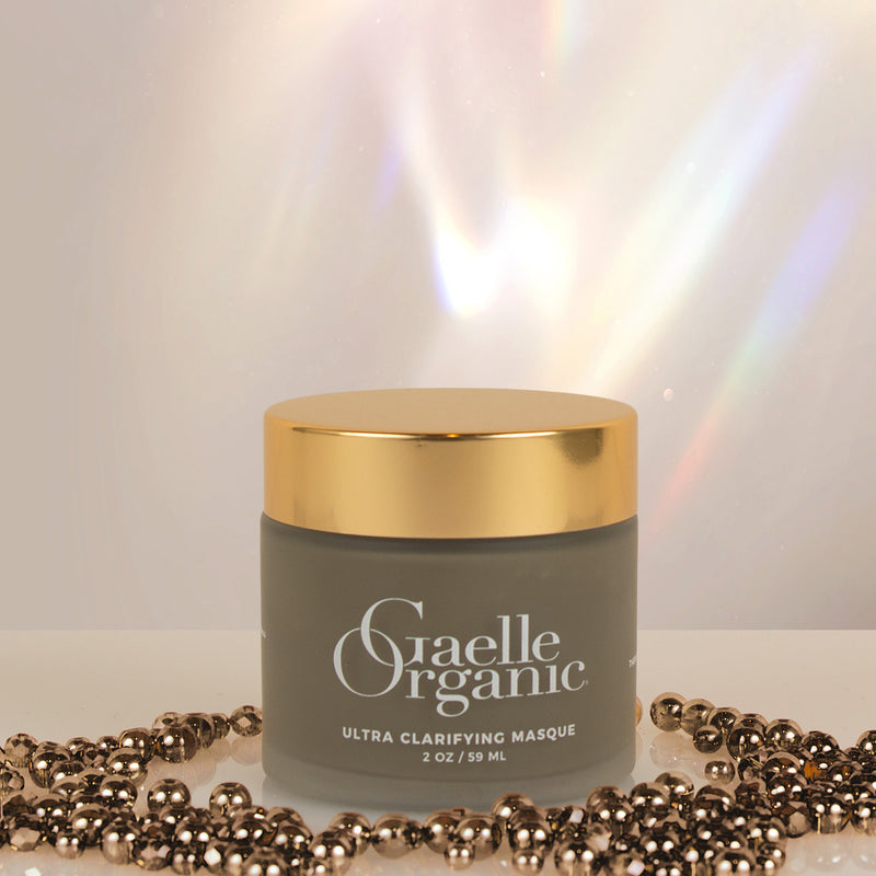 The best mask for sensitive skin, Ultra Clarifying Masque on a white platform with dark shiny beads.