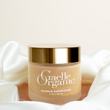 Masque Superieure, the best organic mask for sensitive skin, on a pink stone with a white silk scarf